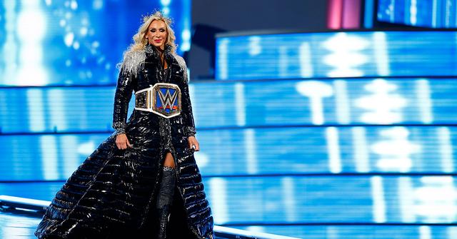Charlotte Flair wearing her belt during Wrestlemania 39.