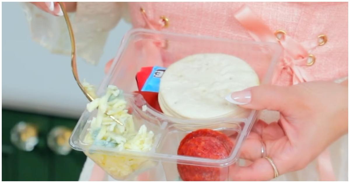 A closeup of Rosanna Pansino's moldy cheese in her Lunchly