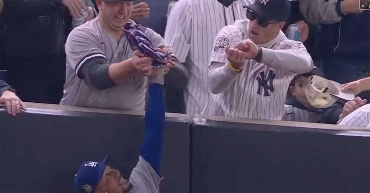 Fans interfering with a catch from Mookie Betts. 