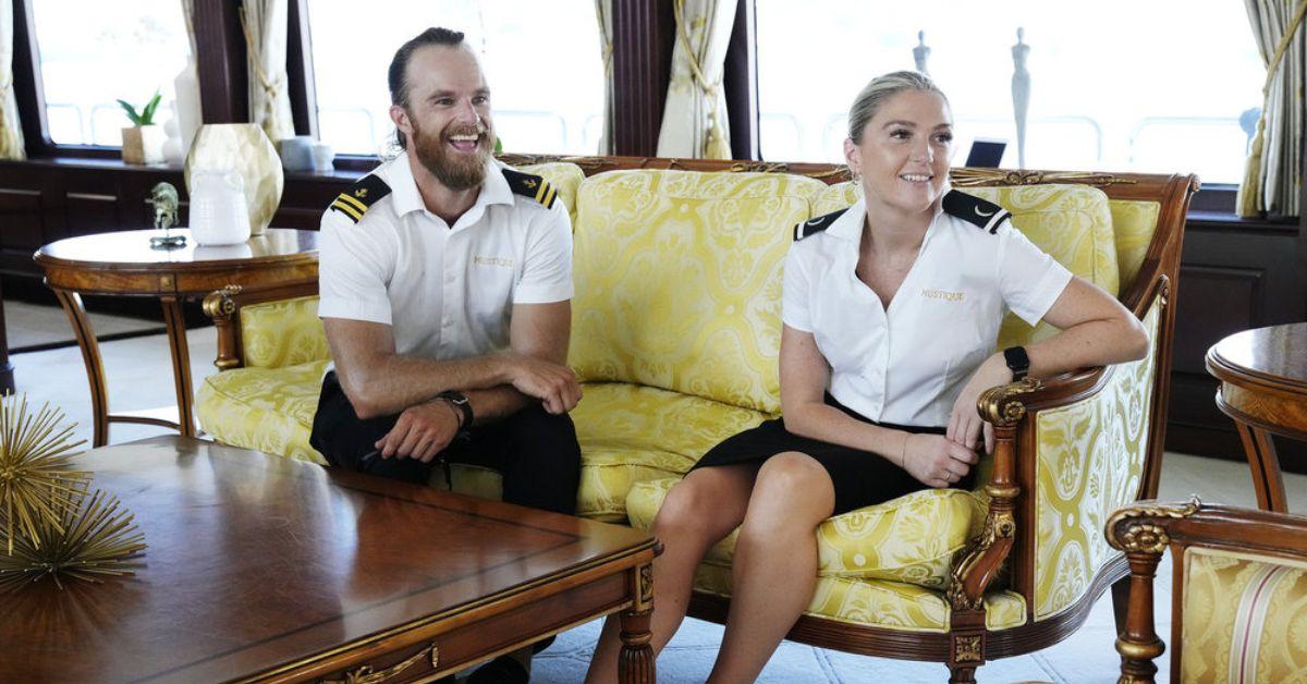 Iain Maclean seated on a couch with Carrie O'Neill as they speak to someone off screen