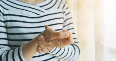 woman-massaging-her-arthritic-hand-and-wrist-picture-id907593640-1552496920305.jpg
