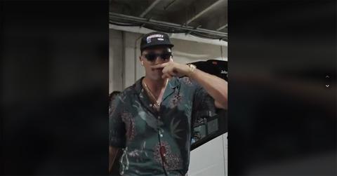 Travis Kelce puts his finger under his nose.