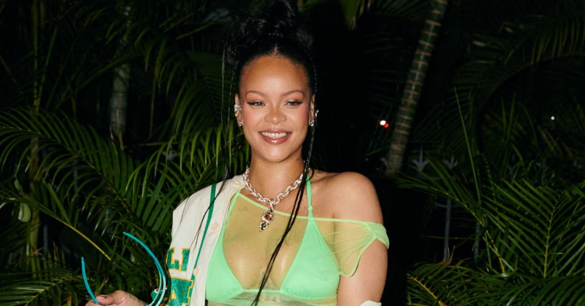 Rihanna posing at a Fenty Barbados event.