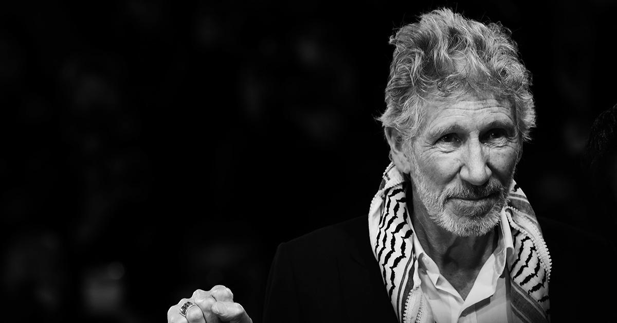 Roger Waters in a scarf on the red carpet. 