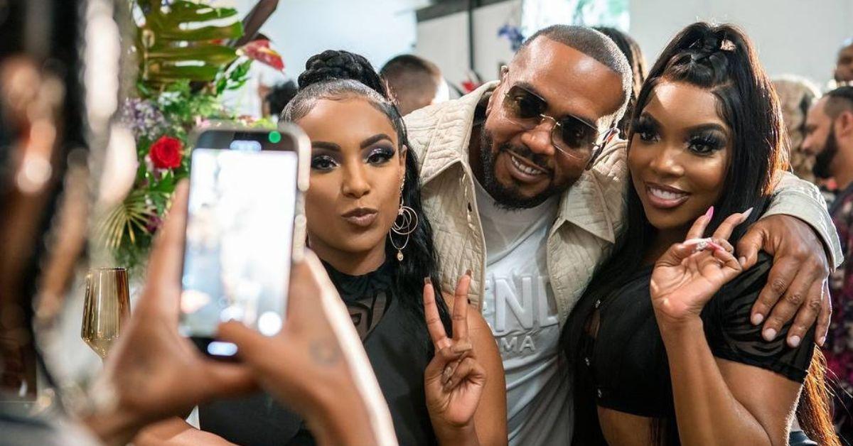 (l-r): Aida Osman as Shawna, Timbaland, and KaMillion as Mia posing together in 'Rap Sh!t' Season 1.