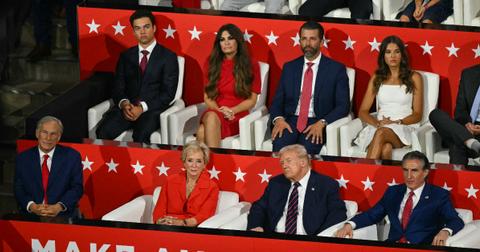 US TV news personality Kimberly Guilfoyle (2L), her son Ronan Anthony Villency (L), Son of former US President Donald Trump Donald Trump Jr., his daughter Kai Madison Trump sit with Texas Governor Greg Abbott (front L), US former President and 2024 Republican presidential candidate Donald Trump (front 2R) and Governor of North Dakota Doug Burgum (frontR) during the third day of the 2024 Republican National Convention at the Fiserv Forum in Milwaukee, Wisconsin, on July 17, 2024. Days after he survived an assassination attempt Donald Trump won formal nomination as the Republican presidential candidate and picked Ohio US Senator J.D. Vance for running mate. (Photo by ANGELA WEISS / AFP) (Photo by ANGELA WEISS/AFP via Getty Images)