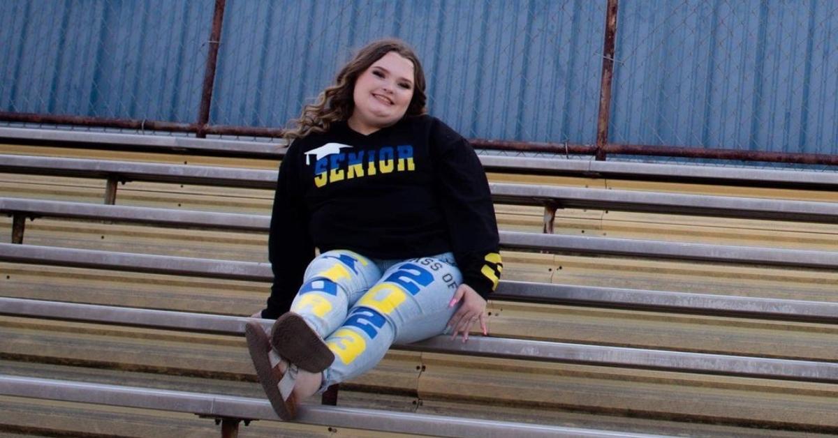 Honey Boo Boo sits on the bleachers at her high school football field