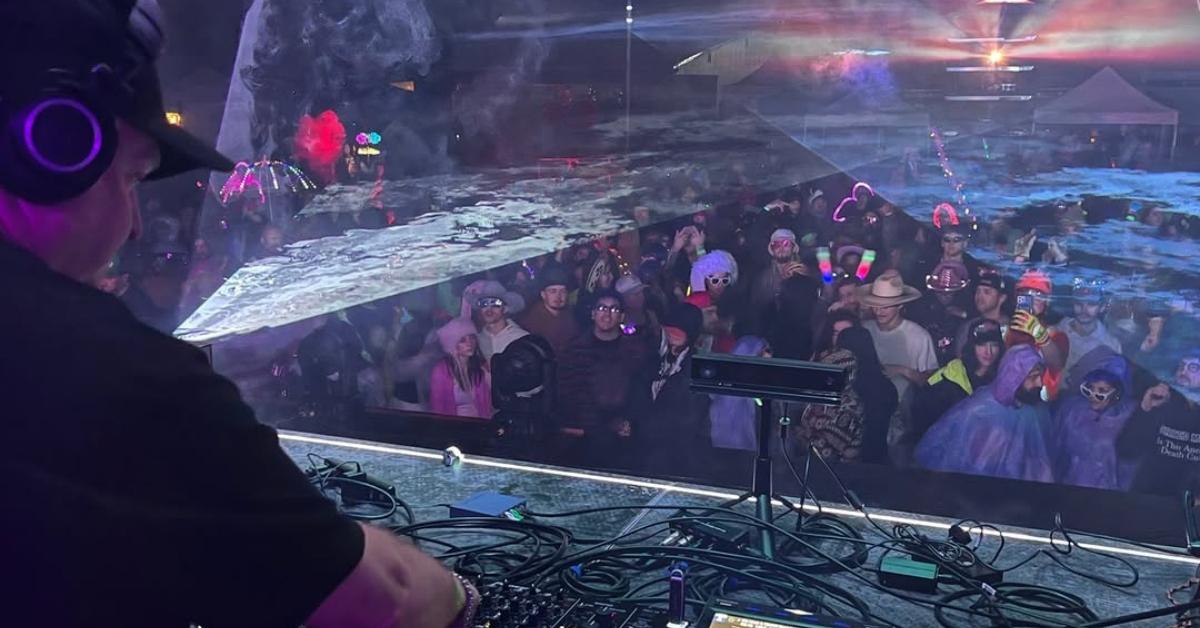 DJ Dan performing at a live event.