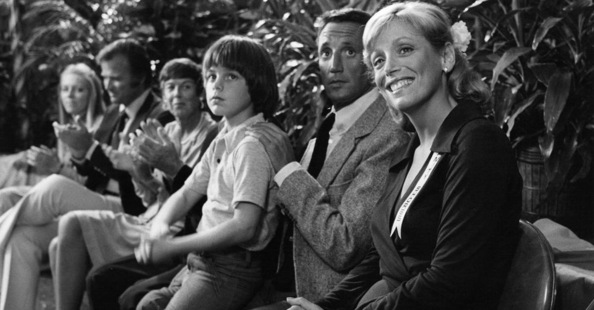 Marc Gilpin, Roy Scheider, and Lorraine Gary sitting at event in a scene from the film 'Jaws 2', 1978.